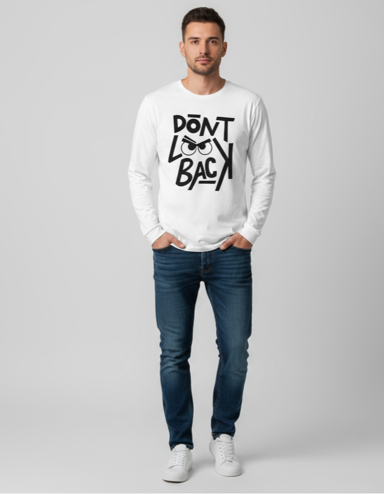 Man wearing a white sweatshirt with text and blue jeans on a gray background
